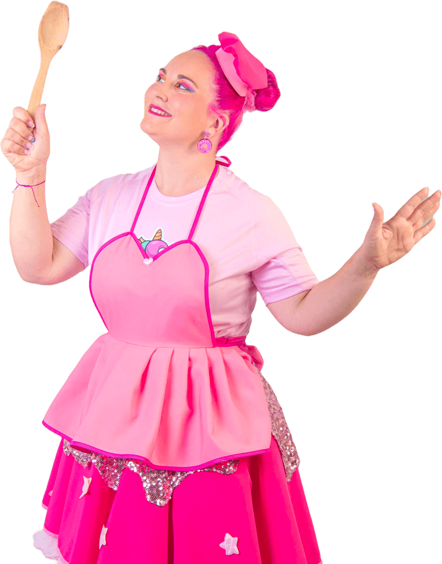 Cuca in her apron with the spoon up in the air, deciding the next ingredient