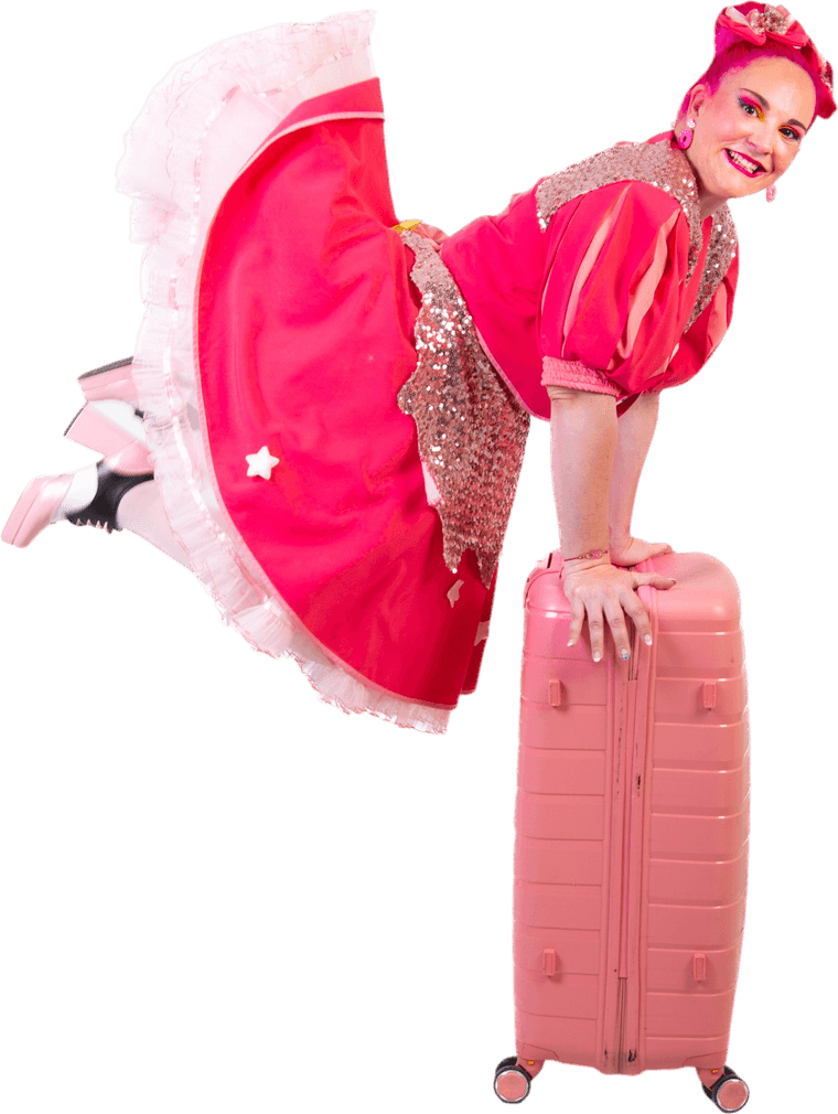 Cuca leaning on her pink suitcase